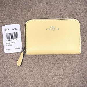 Pastel yellow coach coin purse